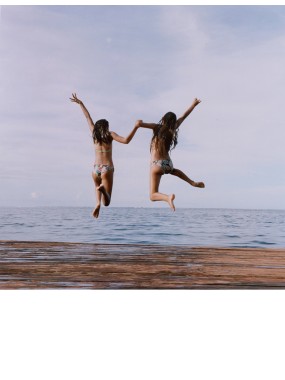 girls jump into the lagoon